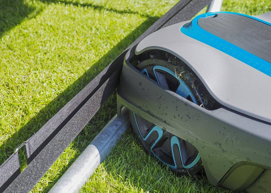 Effortless trampoline leg protection in place for robotic lawn maintenance.